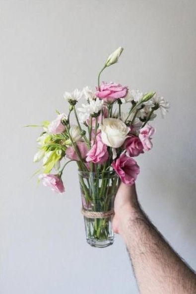 Artist hands arranging roses